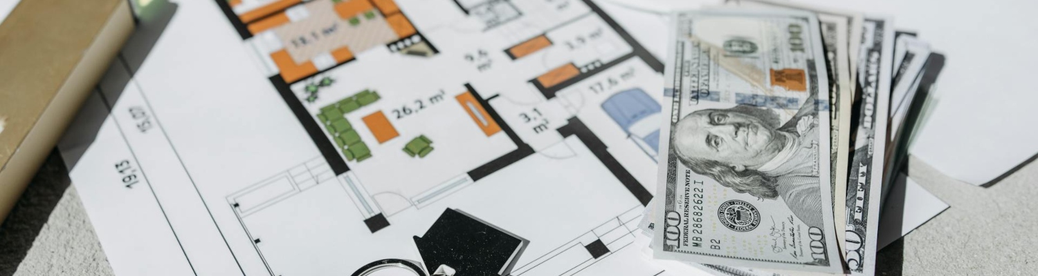 a home plan, keys, and dollars